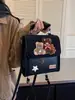Bolso de Leopardo Súper Caliente de Nicho para Mujer 2026 Nuevo Otoño/Invierno Mochila Versátil Estilo Escolar Para Clase Viajes Diarios Mochila Escolar Pequeña