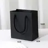 Bolso de mano simple de color liso bolsa de papel caja de joyería a juego bolsa de regalo regular bolsa de embalaje para caja de joyería de pulsera