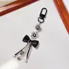 Ins Coreano Nuevo Colgante de Bolso con Lazo Negro Llavero Colgante Accesorios Cadena Colgante para Teléfono Móvil de Pareja