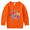 2026 Nova Camiseta Infantil de Primavera e Outono Gola Redonda Desenho Animado Manga Longa Camiseta Básica Conjunto para Meninos e Meninas Camiseta de Algodão