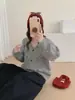Chaqueta suéter de punto a rayas de color contrastante con cuello en V estilo coreano, nuevo cárdigan de punto versátil de ajuste holgado para mujer, otoño e invierno 2026
