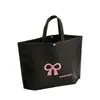 Bolso de mano para mujer de gran capacidad con logo impreso, tienda de ropa de alta gama, bolsa de regalo verde para compras, lazo, venta al por mayor