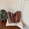 Bolsa Tote Vintage de Alta Calidad 2026 Nuevo Modelo Bolso de Hombro Único Gran Capacidad para Viajes Cotidianos Bolso de Mano Simple Bolso de Axila Transfronterizo