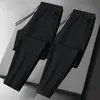 Calças masculinas para primavera e outono, calças casuais da moda com bolsos com zíper, calças esportivas jogger retas largas