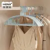 Perchas de plástico domésticas sin costuras de hombro ancho y engrosadas, perchas de plástico antideslizantes para adultos para ropa y pantalones, venta al por mayor para dormitorios y estudiantes