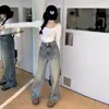 Jeans de estilo americano lavados a la piedra y desgastados para mujer, pierna recta de ajuste holgado para primavera/otoño, pantalones largos con vibra de alta costura europea y americana