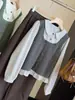 Camisa dulce de estilo universitario con bloques de color y cuello de muñeca para mujer, nuevo estilo de otoño, versión coreana, top elegante con volantes que reduce la edad, falso dos piezas