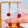 Pendientes de Bola Rojos Festivos de Gama Alta con Borla de Diamantes Completos Diseño de Nicho Estilo Chino Simples Pendientes Blancos de Gama Alta