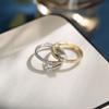 Anillo de pareja al por mayor, joyería ligera de lujo de alta gama para mujer, anillo de boca suelta asimétrico sin color para hombre, combina con todo.