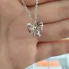 2023 Nuevo collar de mariposa hueca hip hop todo partido colgante de mariposa de circón accesorios de moda geniales para la tierra sentido del diseño