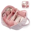 Nueva bolsa de maquillaje portátil transfronteriza, bolsa de almacenamiento de brochas de maquillaje de gran capacidad para llevar en la mano, neceser de viaje de alta gama