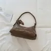 Bolsa de grande capacidade Shuai Mi Jia outono 2026 nova bolsa de ombro transversal retrô de nicho para aula e deslocamento bolsa de bolinho