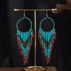 Joyas populares europeas y americanas fuente transfronteriza estilo étnico bohemio retro pendientes largos de borla de cuentas de arroz para mujer