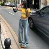 Foto real de jeans rectos elegantes con patrón de estrella de pedrería para mujer, nuevos pantalones de pierna ancha de cintura alta adelgazantes para la primavera de 2026