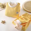 Traje de ropa interior de forro polar para niños otoño e invierno Nuevo engrosado cálido ropa de otoño pantalones largos pequeños y medianos para hombres y mujeres traje base para el hogar