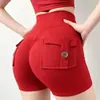 Nuevos shorts de yoga estilo ropa de trabajo transfronteriza con diseño de trasero en forma de durazno, cintura alta, tela elástica, efecto levanta glúteos, cierre de botón y material de secado rápido; hecho a medida