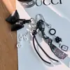 Pingente de Bolsa Estilo Miu com Sino e Pom-Pom, Chaveiro de Celular Outono e Inverno, Laço, Estilo Retro de Nicho