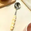 Acero Inoxidable 304 Mango de Cerámica Cuchara de Perla de Cuatro Colores Alta Apariencia Cuchara para Postre Casero Cubiertos Creativos para Cocina Occidental