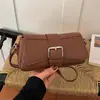 Bolsa de ombro feminina transfronteiriça, design de nicho, bolsa para o dia a dia, nova bolsa versátil de ombro e transversal feminina outono 2026