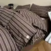 Nuevo conjunto de cuatro piezas de algodón y lino estilo botón simple de lujo ligero, estilo minimalista de Instagram, conjunto de tres piezas de hilo de rizo de algodón puro para ventas transfronterizas