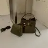 Bolsa Saco Retro Camurça Melanóide Feminina 2026 Outono/Inverno Nova Bolsa de Mão Trançada Pingente de Miçangas Bolsa de Ombro Único Transversal
