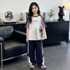 Conjunto de verano de manga corta para niños y niñas, nuevo modelo 2026, ropa fina de verano para niños mayores, conjunto de dos piezas con pantalones deportivos para niños