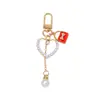 Mini Bolso Colgante Llavero Perla Amor Borla Colgante Niña Funda de Auriculares Decoración Accesorios DIY