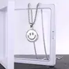 Collar giratorio con cara sonriente de acero de titanio, colgante de expresión giratoria estilo hip hop con cambio de humor, joyería artística para hombres y mujeres con cara llorando.
