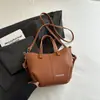 Bolso Cubo Estilo Nuevo Simple Retro Bolso Casual de Moda 2026 Otoño Nuevo Estilo Bolso de Hombro Cruzado Texturizado para Mujer