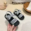 Sandalias tejidas de estilo coreano para niñas 2026 verano nuevo zapatos de princesa de suela blanda para niños zapatos de playa con lazo para niñas pequeñas