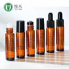 Botella de vidrio con aplicador de bola roller de 10 ml, color marrón, para venta al por mayor, botella de spray gotero de aceite esencial, botella vacía, portátil para viajes