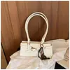 Elegante y a la moda bolso de hombro y cruzado, versátil para el trabajo, nuevo bolso de mano casual versión coreana 2026