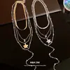 Collar con colgante de corazón de circón con cuentas de perlas estilo coreano, juego de cuatro piezas, cadena para la clavícula de lujo ligero y de alta gama, accesorio versátil para mujer
