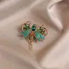 Nuevo Broche de libélula verde refinado para goteo de aceite transfronterizo Broche de corsage de insecto esmeralda de lujo ligero de alta calidad