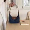 2026 Nova Bolsa Térmica Impermeável de Nylon para Marmita Design de Nicho Bolsa de Mão para o Trabalho Casual Versátil Ombro Único Bolsa de Dumpling Feminina