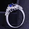 Joyería de explosiones de comercio exterior de alta gama Europa y Estados Unidos popular anillo de compromiso para dama circón azul de alta gama anillo de oro real al por mayor