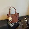 Bolsa de balde transfronteiriça, estilo descontraído, uma bolsa transversal moderna e fashion para mulheres, apresentando um design simples de cor sólida, e pode ser carregada como bolsa de mão ou bolsa de ombro