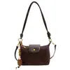 Bolso de gamuza para mujer, nuevo modelo de otoño 2026, bolso de hombro bajo de nicho vintage de alta gama, bolso cruzado para el día a día