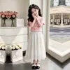 Moda de Verano Casual con Estampado de Flores Top de Manga Corta para Niños Mayores 2026 Nuevo Dulce y Lindo Conjunto de Dos Piezas con Falda Larga