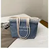 Bolsa de Ombro Tote Casual da Moda Tendência Feminina 2025 Novo Estilo de Verão Estilo Estrangeiro Simples Grande Capacidade