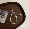Chaveiro estilo coreano ins nova menina doce laço de pérola pingente de coração de prata alça de celular acessório de fone de ouvido