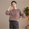 Otoño 2026 Nuevo Estilo Suéter de Lana Cuello Redondo para Mujer Estilo Perezoso Retro Manga Larga Tejido Suelto Parte Superior Cepillada