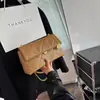 Bolsa com textura de celebridade da internet feminina novo estilo outono 2026 moderna fashion bolsa de corrente losango bolsa de ombro único transversal feminina nicho