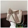 Bolsa de Palha Tecida Moda Estilo Coreano com Laço, Grande Capacidade, Tendência Verão com Rebites, Bolsa de Praia Personalizada para Ombro e Mão