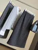 Moderna y elegante falda midi de mezcla de lana con lunares para mujer 2026 Otoño Nueva Cintura Alta Adelgazante Abertura Trasera Ceñida Recta