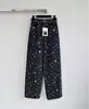 Mercadorias Nanyou de Shenzhen~25 Nova Coleção Outono/Inverno: Jeans Feminino Preto Estampado de Perna Larga Estilo Chanel