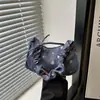Bolso de mano versátil de mezclilla para mujer, nuevo estilo 2026, bolso de moda para chica, bolso de hombro plisado para el trabajo
