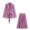 Traje de dos piezas para mujer con falda plisada, estilo para ir al trabajo, cintura ajustada, chaqueta de manga larga con detalle de corbata y falda larga. Venta al por mayor transfronteriza, disponible en 12 colores
