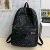 Mochila escolar transfronteriza, diseñada para chicas de secundaria, con un estampado de estrellas fresco y lindo, una mochila versátil adecuada para estudiantes de preparatoria y salidas diarias.