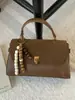 Bolsa de Mão Retrô Feminina 2025 Nova Inverno High-End Nicho Luxo Acessível Bolsa de Ombro para o Dia a Dia Transversal Pequena Quadrada